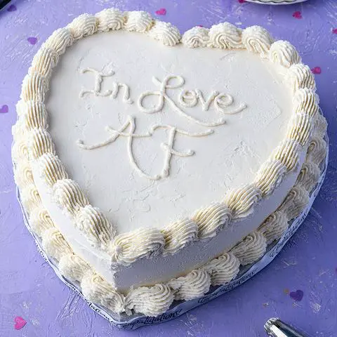white anniversary heart cake.