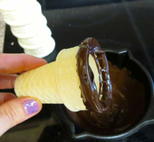 Coating ice cream cones in chocolate