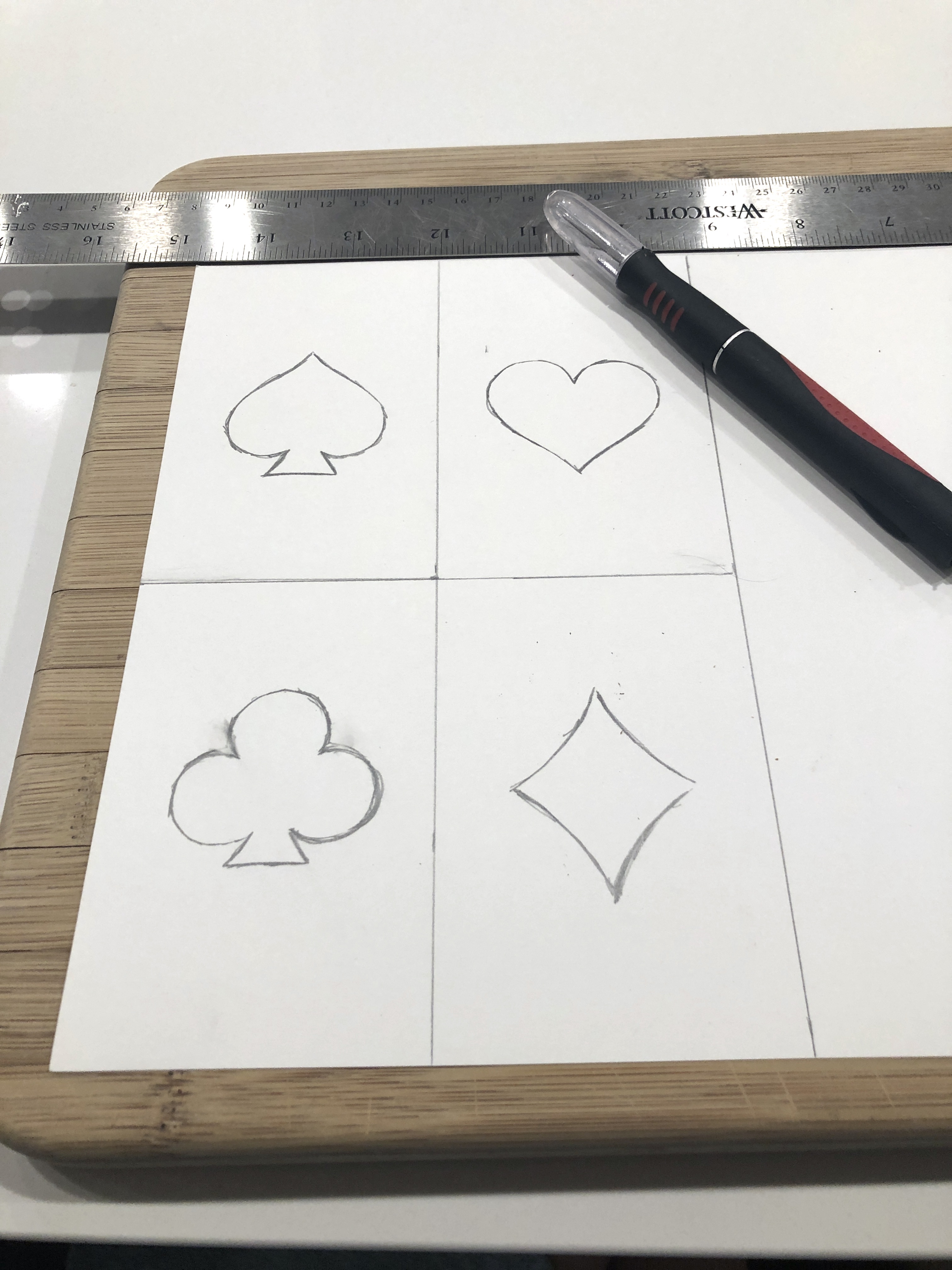 making a template out of cardstock for my playing card cookies