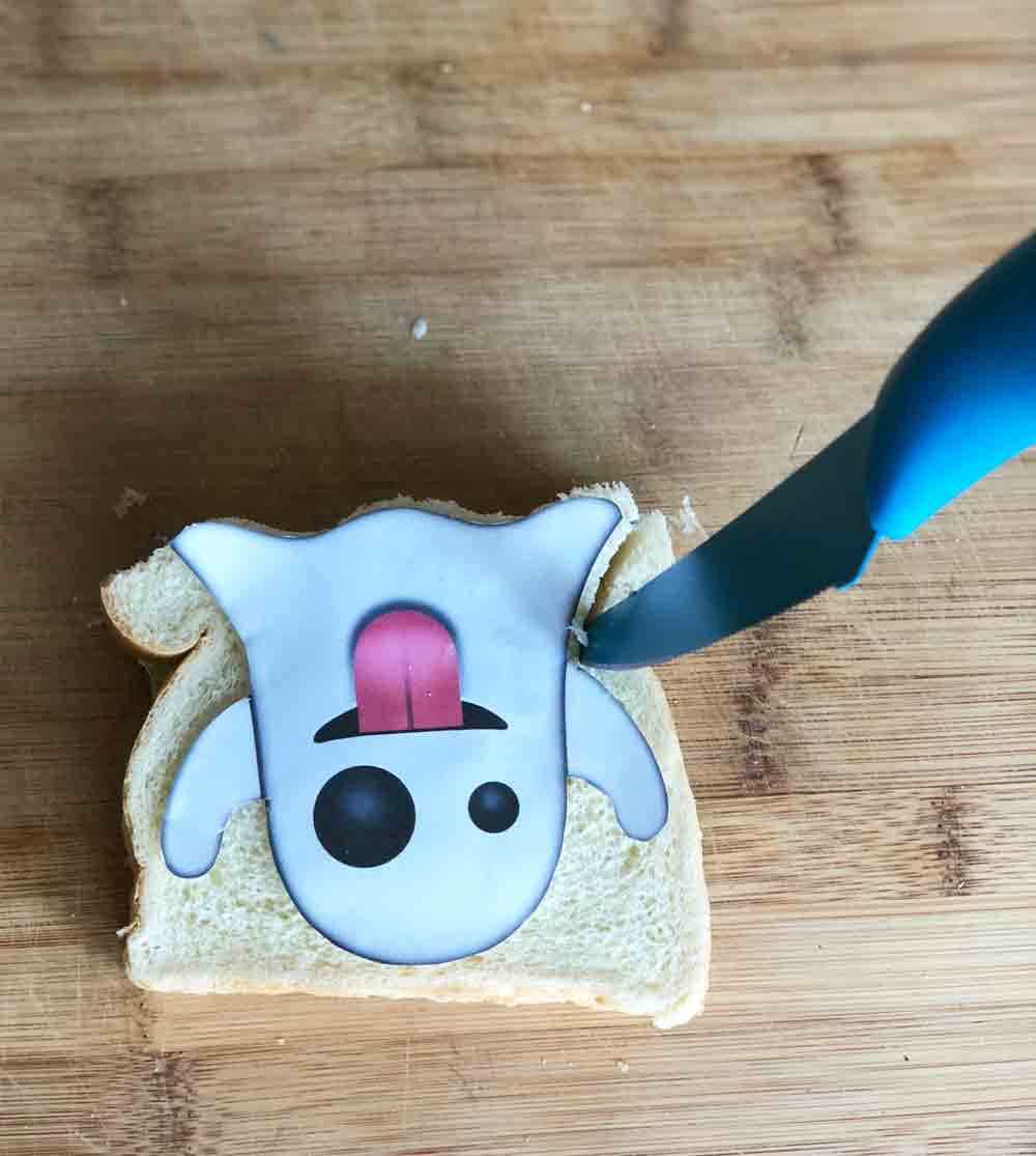 cutting out vegan ghost emoji tea sandwiches