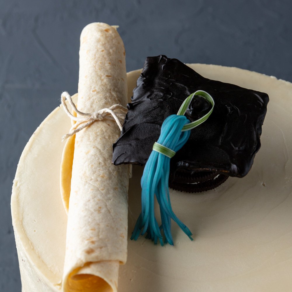 a closeup of the homemade vegan graduation cake toppers