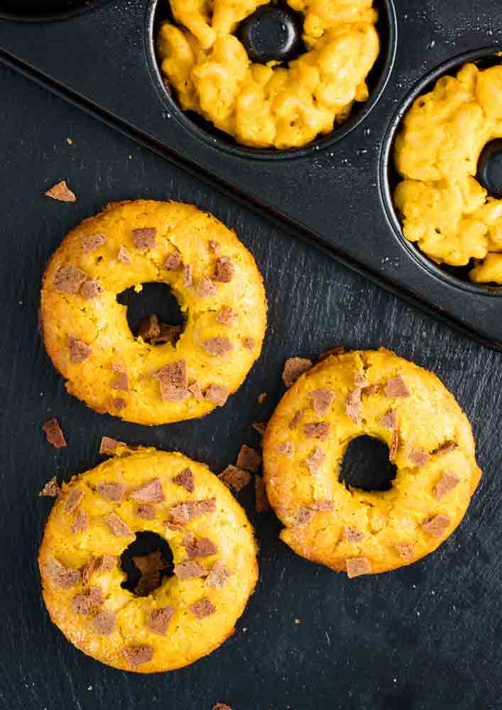 taking vegan mac n cheese donuts out of the pan