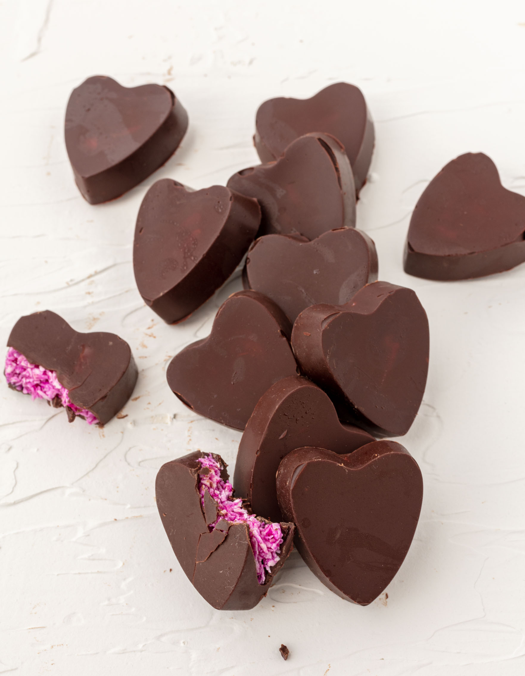 heart shaped chocolates with pink coconut inside.