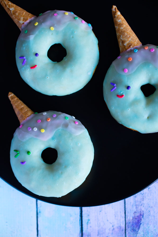 narwhal donuts on a plate.