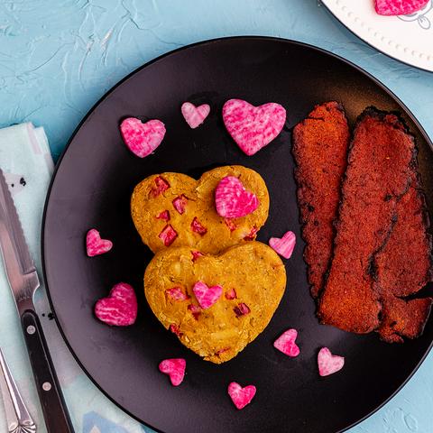 heart shaped Vegan Air Fryer Omelettes on a plate with vegan bacon