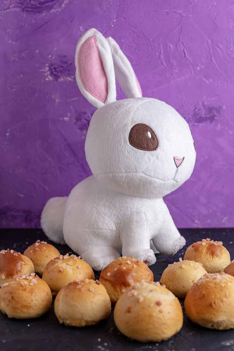 a bunny stuffed animal with a bunch of pretzel bites.