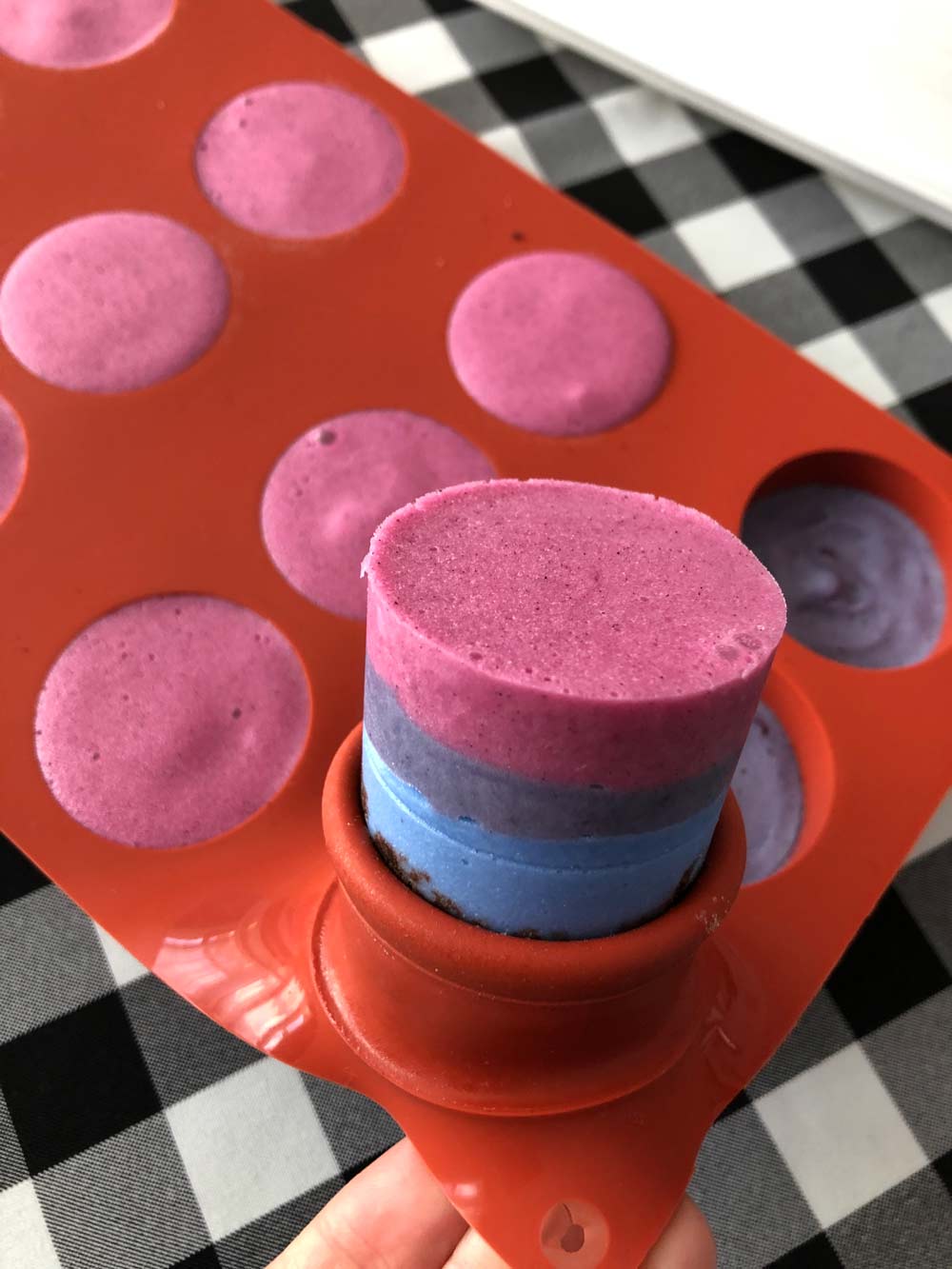 popping the vegan mini ice cream cakes out of the silicone molds