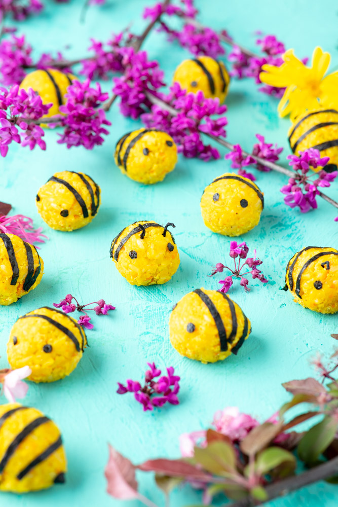 vegan korean rice balls decorated to look like bumble bees