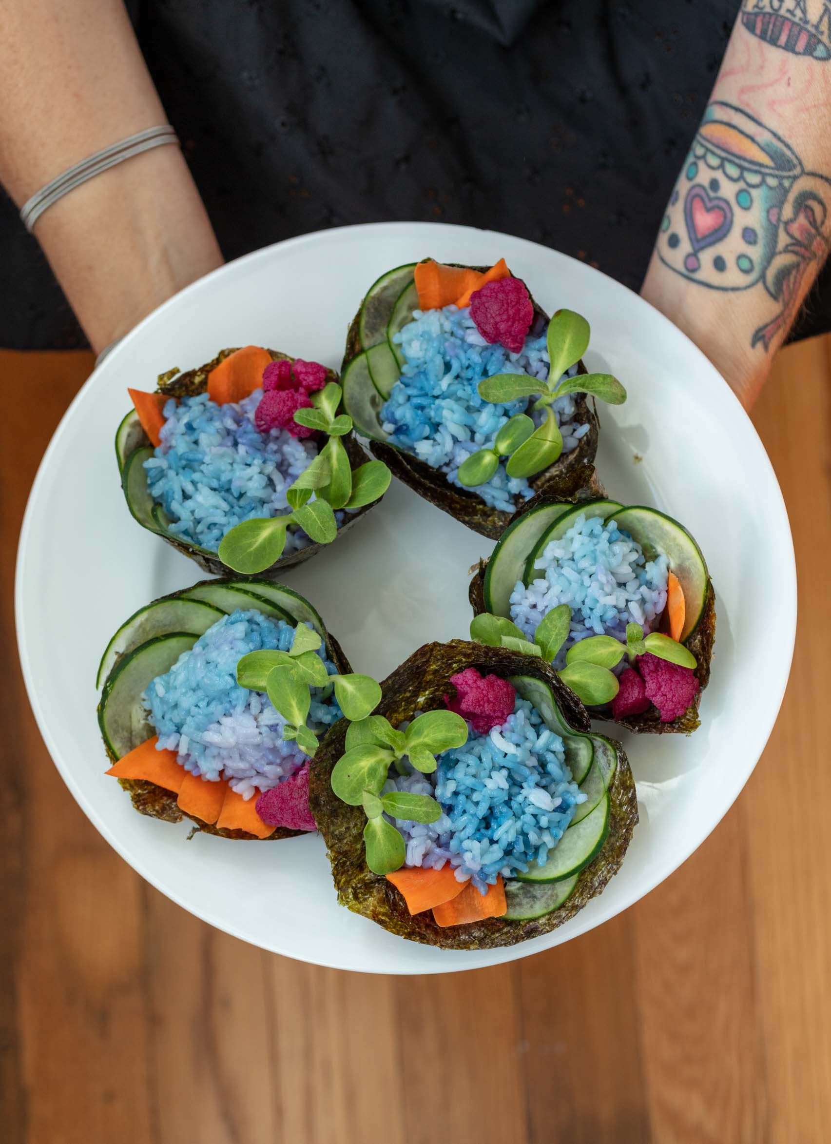colorful sushi cupcakes on a plate.