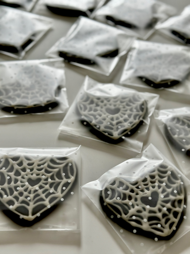 spider web cookies packaged up and ready for delivery