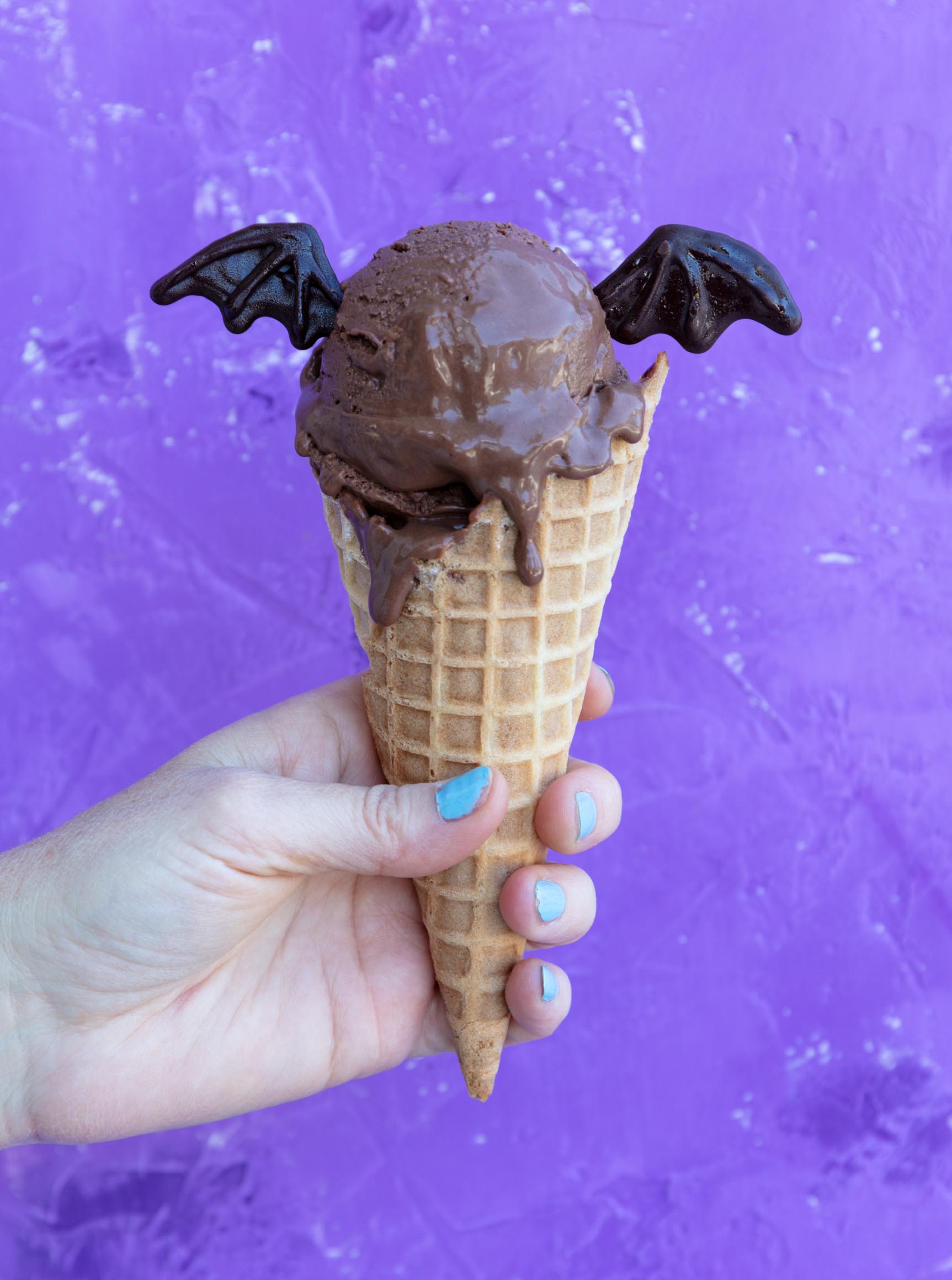 vegan ice cream cone decorated to look like a bat