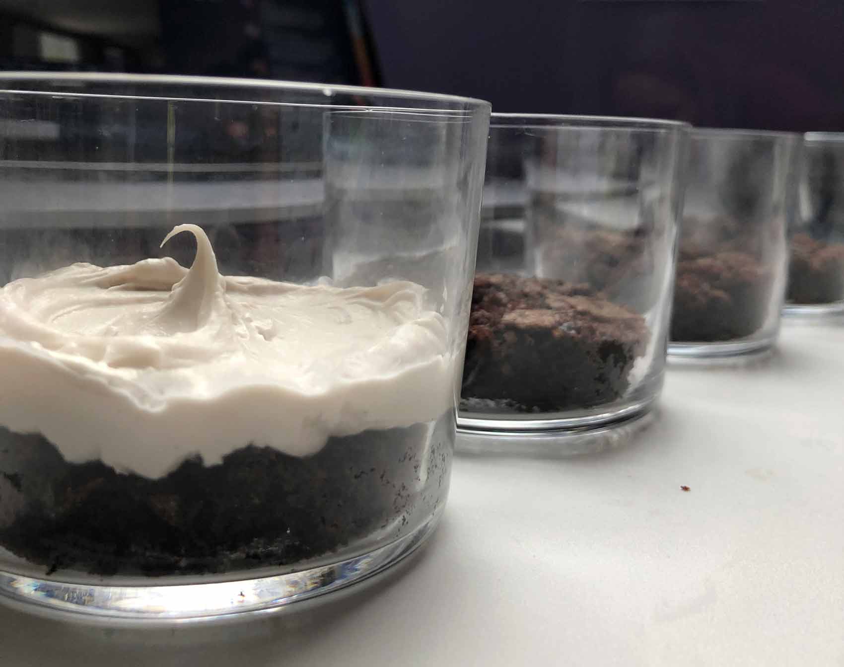 assembling the vegan brownie parfaits