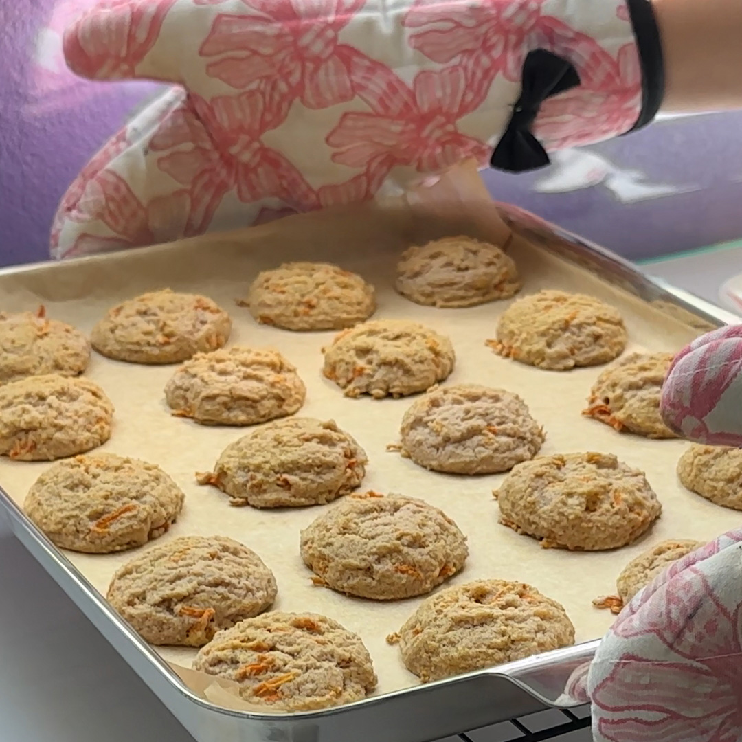 a tray of cookies coming out of the oven.