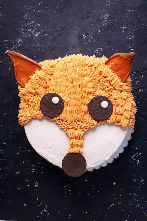 vegan carrot cake decorated to look like a fox