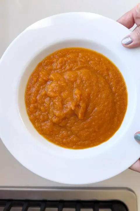 a bowl of vegan carrot soup.