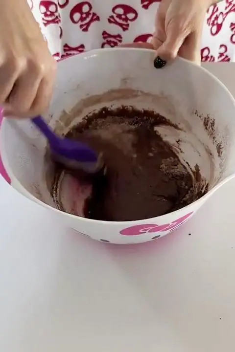 mixing the vegan brownie batter.