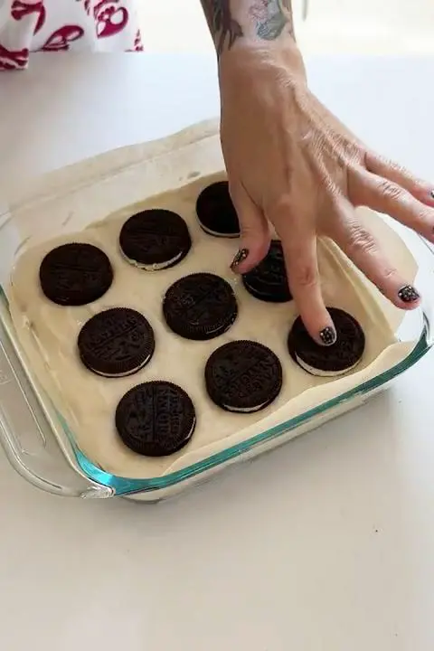 adding the vegan cookies to the top.