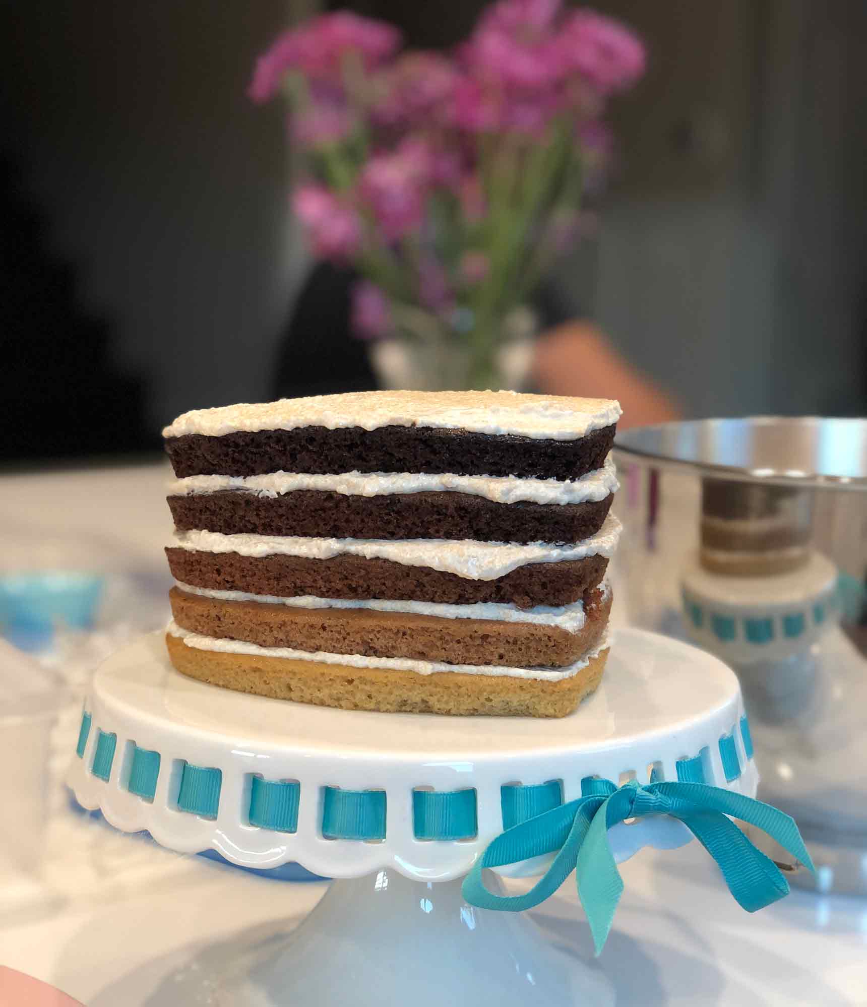 all 5 vegan chocolate ombré cake layers assembled with caramel buttercream frosting