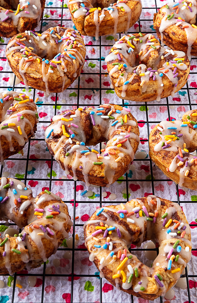Heart-shaped cinnamon roll donuts with sprinkles