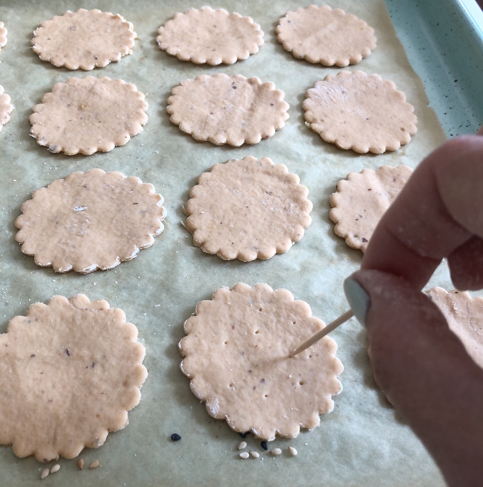 poking holes in the crackers for the steam to escape