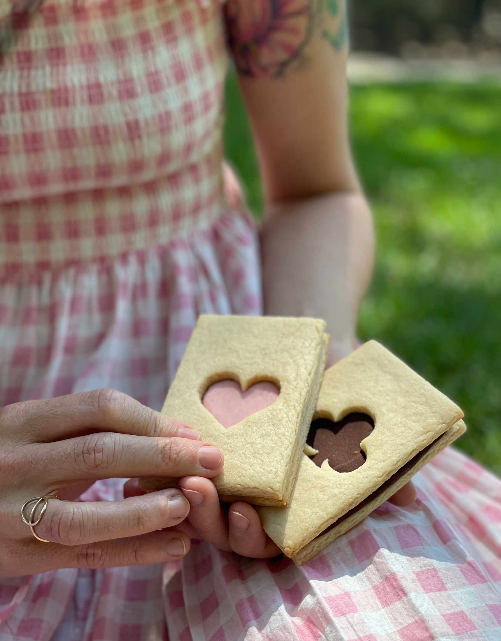 alice with her vegan sandwich cookies that look like playing cards