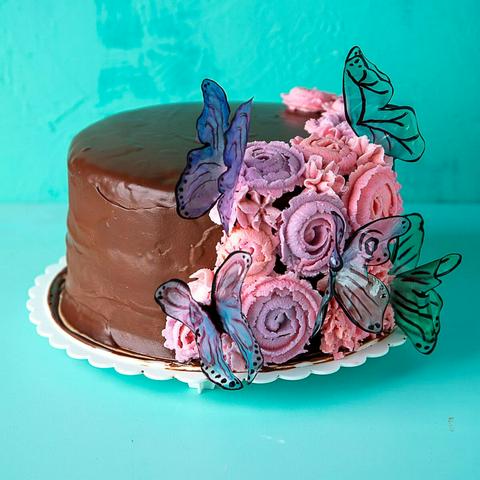 vegan ding dong cake decorated with flowers and butterflies