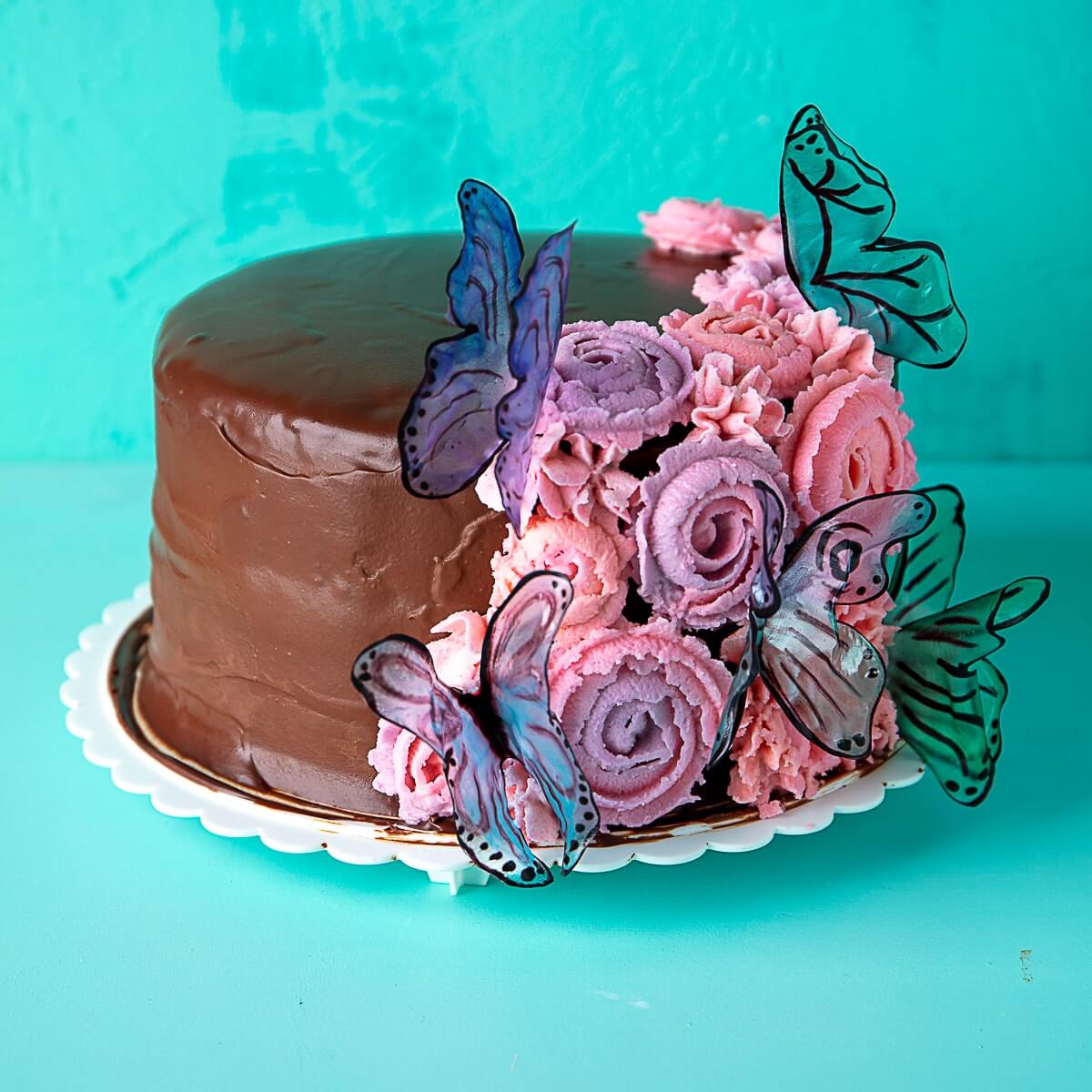 vegan ding dong cake decorated with flowers and butterflies