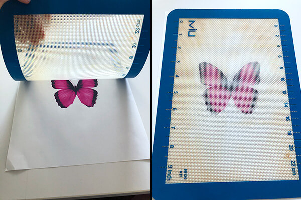 a silicone mat with the picture of a butterfly showing through