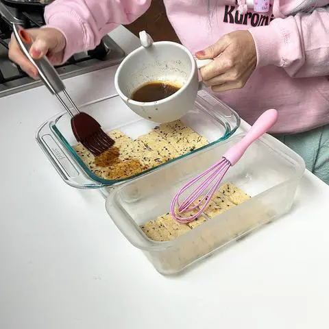 Brushing the marinade on the tempeh.