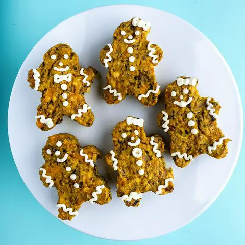 five single serving frittata that are decorated like gingerbread men