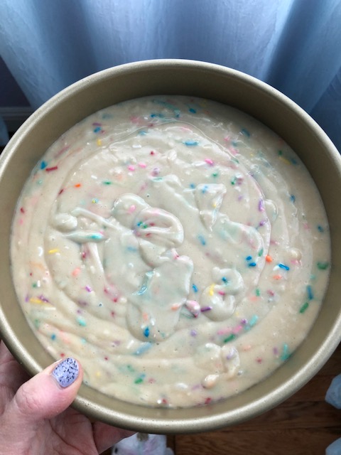 Vegan funfetti cake batter in round cake pan