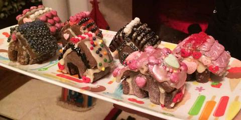 a neighborhood filled with gingerbread dollhouses