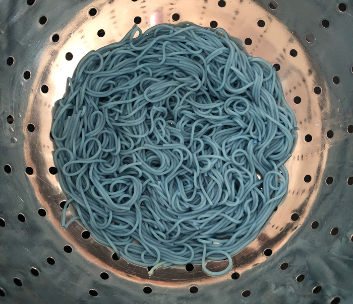 cooked blue angel hair pasta in a colander
