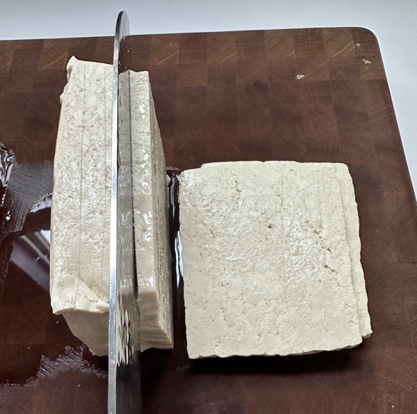 slicing the tofu into 6 slices