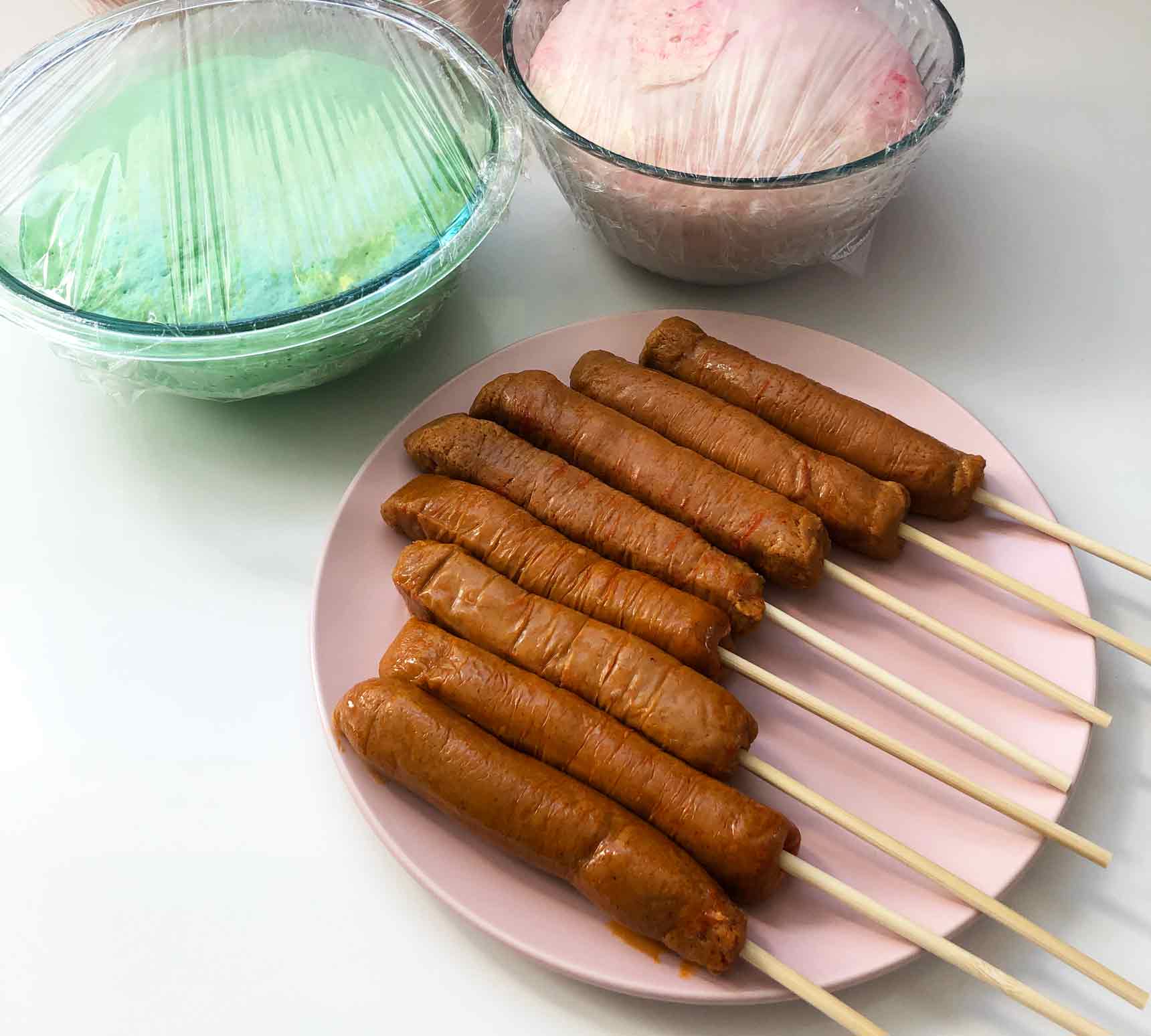 Vegan Garlic Hot Dog Buns on a stick