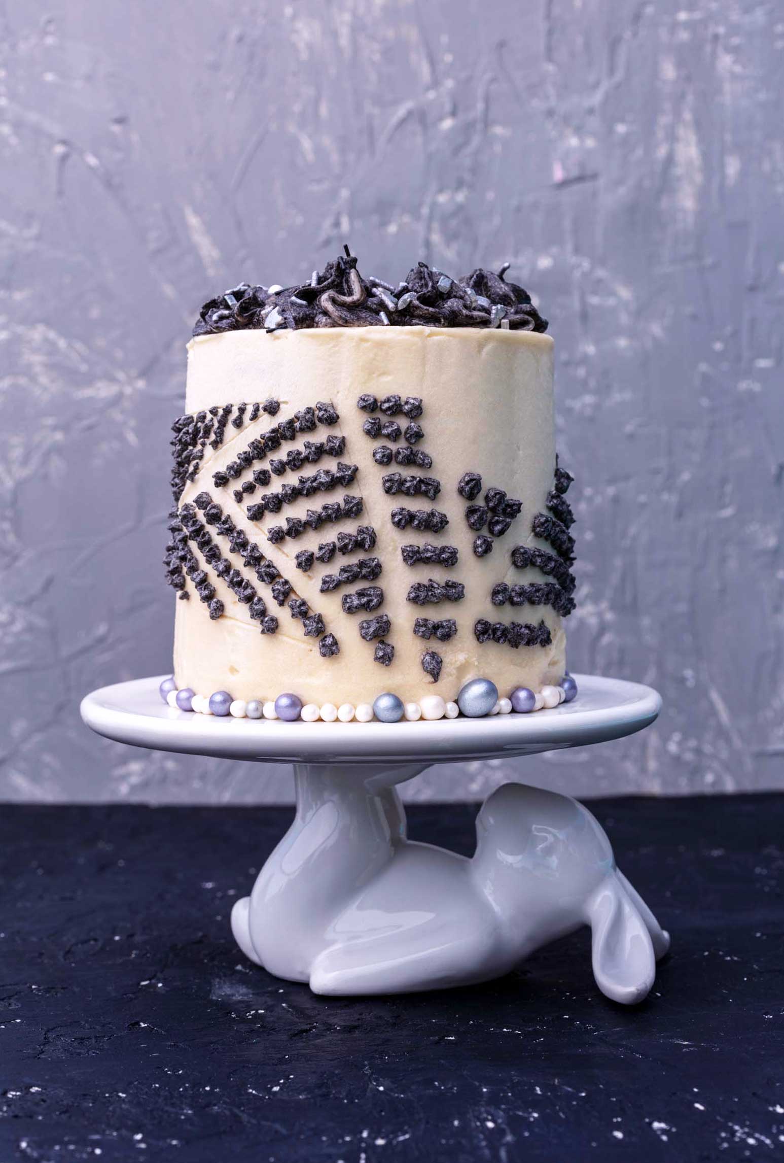 vegan 4” hummingbird cake decorated in a monochrome motif