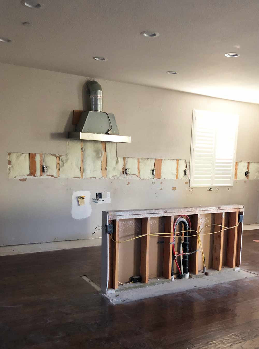 holes in the wall where they cut out the backsplash tiles