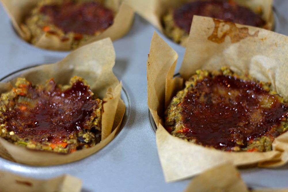 Adding BBQ glaze to each little lentil loaf