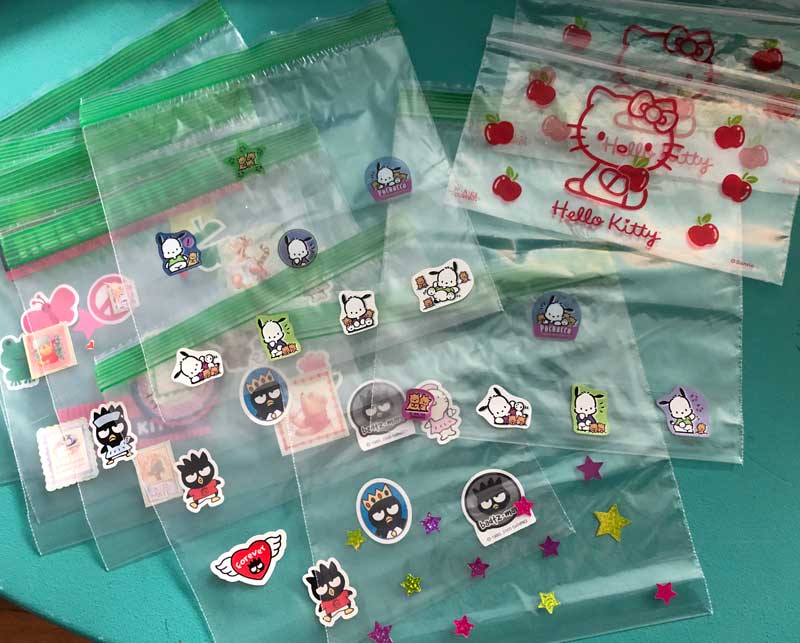 decorating the ziplock baggies with stickers