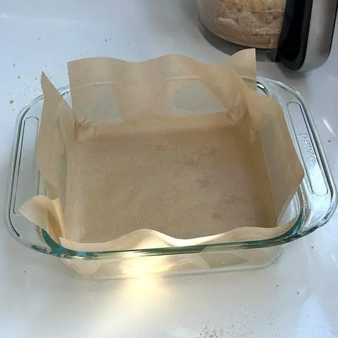 a pan that has been oiled and is lined with parchment paper.