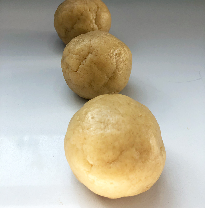 3 balls of uncolored vegan sugar cookie dough