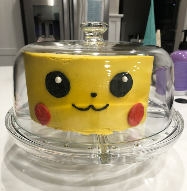 pokemon cake under a glass cake dome