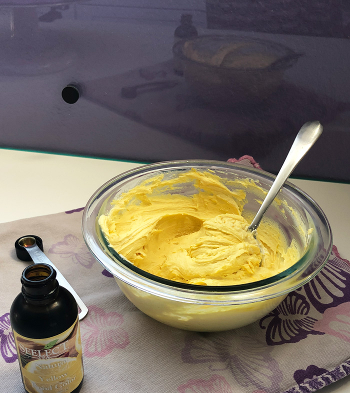 vegan vanilla frosting colored yellow with all-natural food coloring