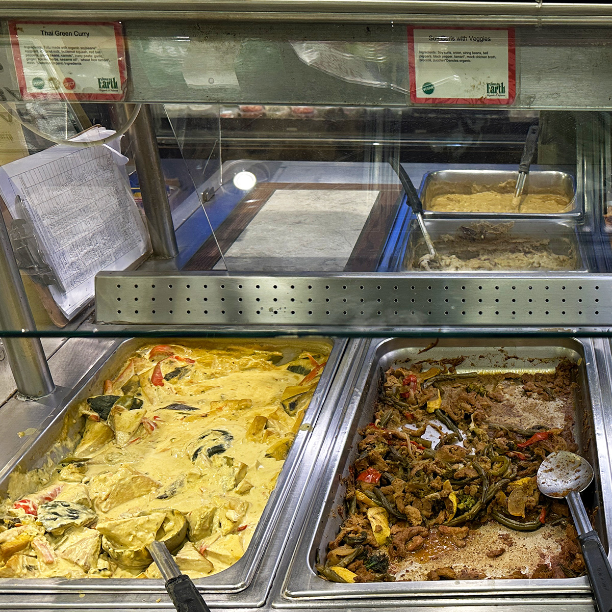 vegan food on the hot bar at Down to Earth in Maui.