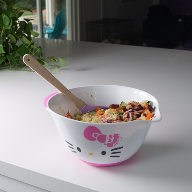 all the salad ingredients in a hello kitty mixing bowl