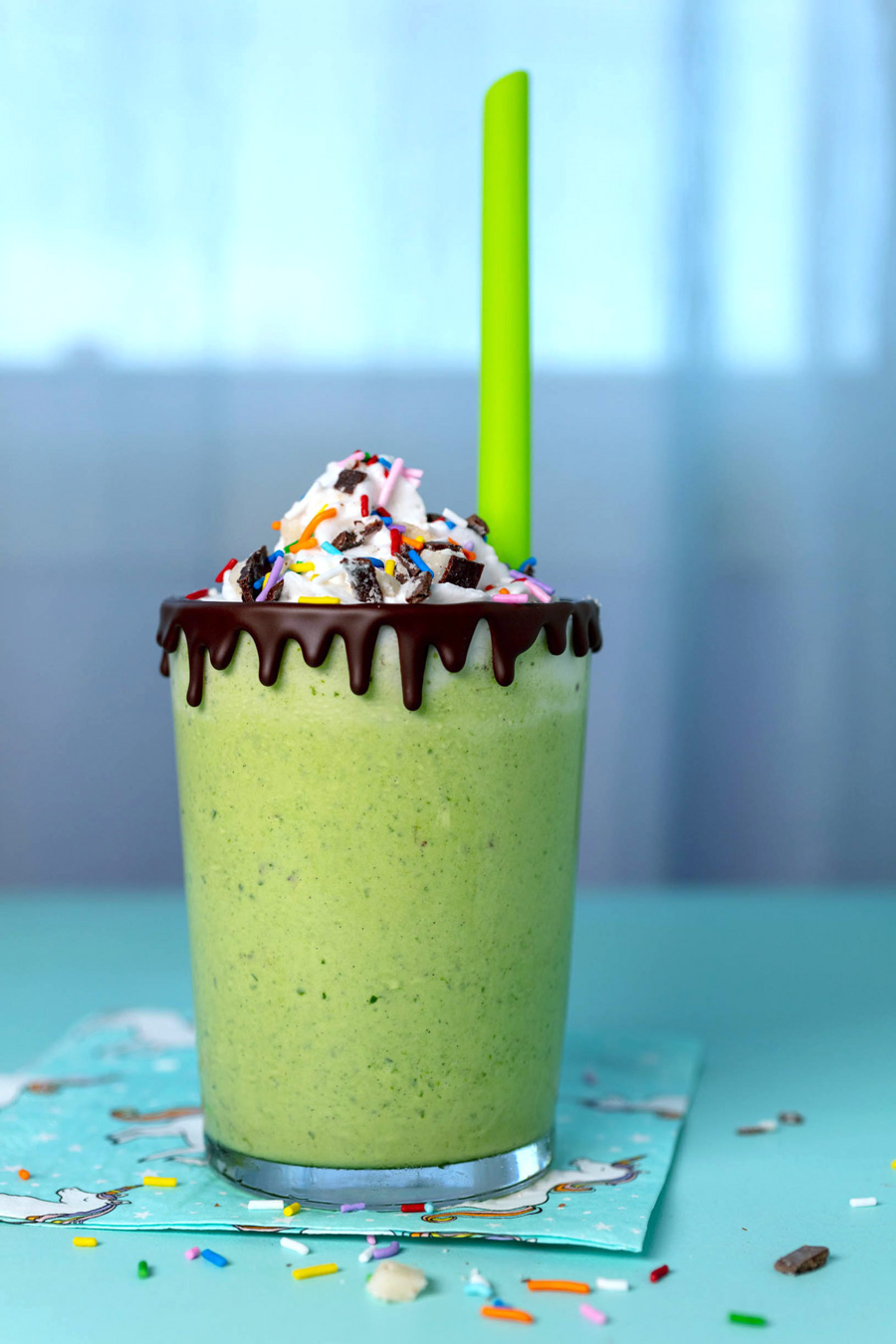 vegan mint milkshake with whipped cream and sprinkles