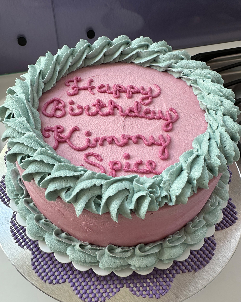 pink nutella cake with teal borders