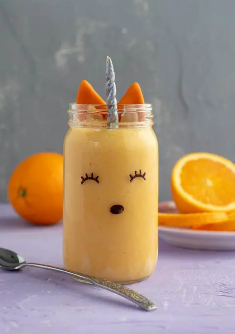 vegan orange julius decorated to look like a unicorn fox