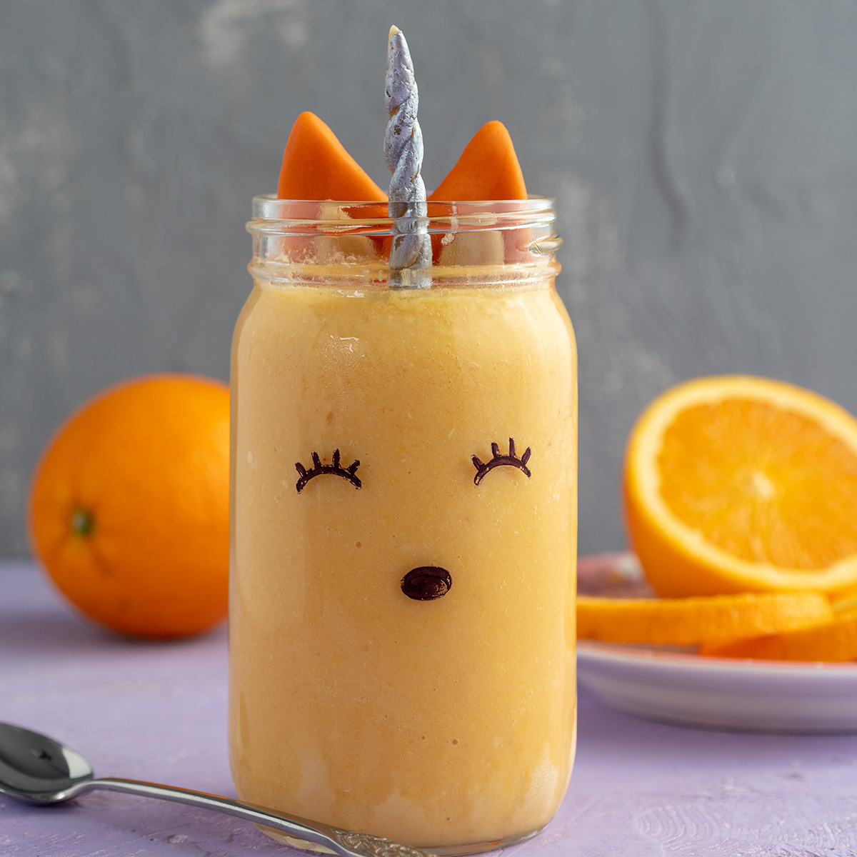 vegan orange julius decorated to look like a unicorn fox