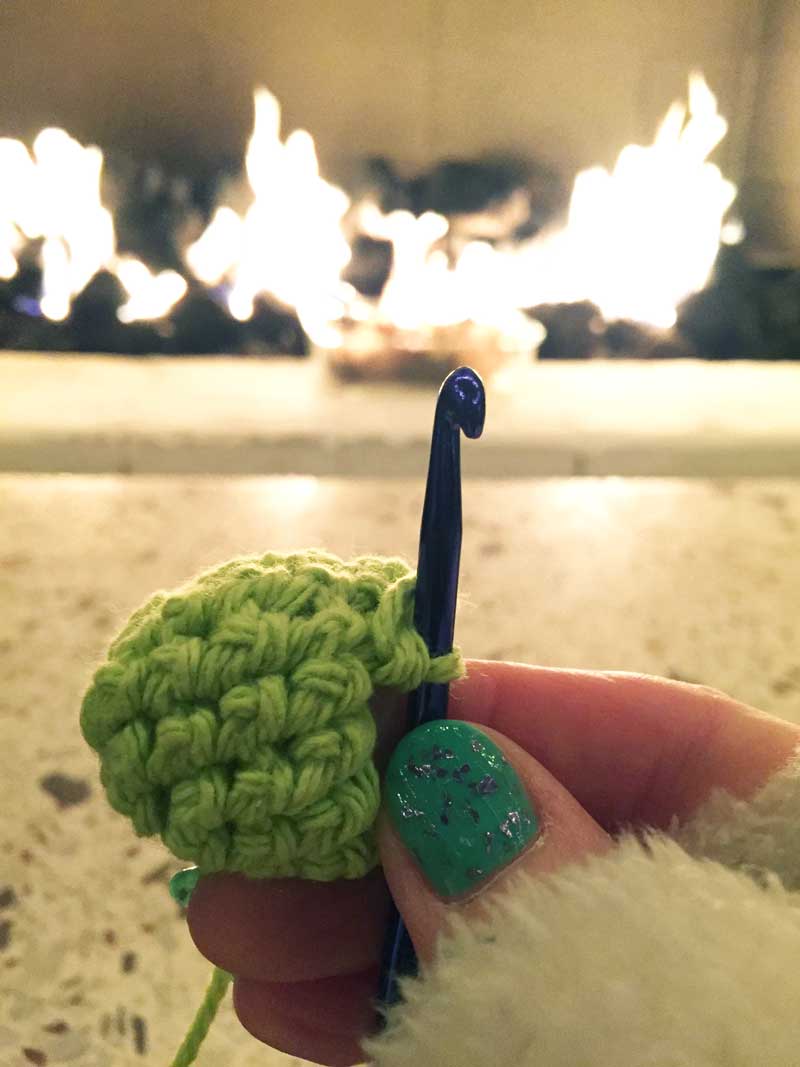 Crocheting by the fire